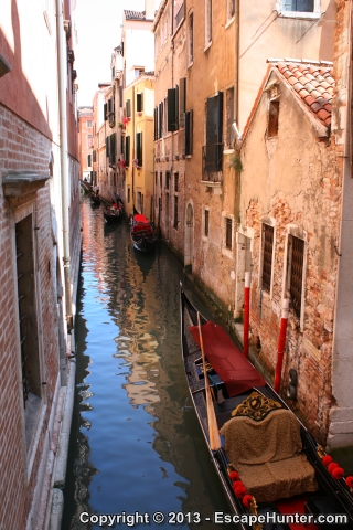 Gondola on narrow water channel