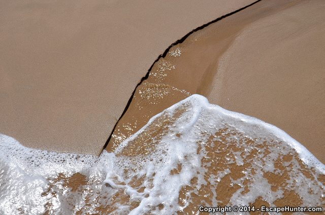 Water carving the sand